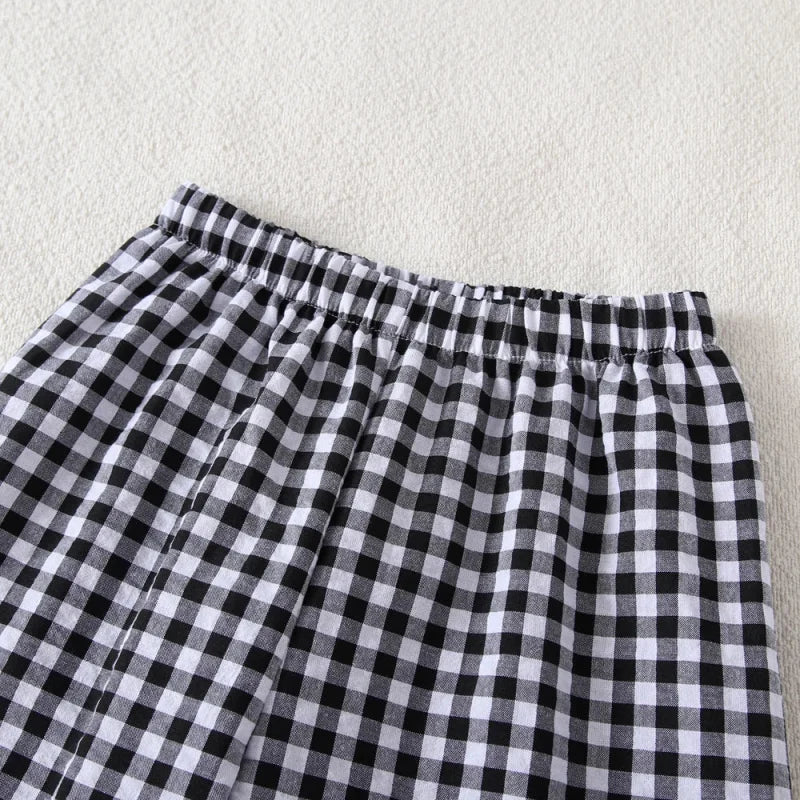 Conjunto Infantil Estampado: Regata com Laço e Calça Xadrez para Conforto e Estilo