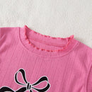 Conjunto Infantil Estampado: Regata com Laço e Calça Xadrez para Conforto e Estilo